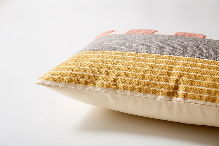 Multicolored striped pillow on a light background Colorful abstract geometric embroidered cushion cover in cotton blend, decorative pillowcase for living room, kids’ room, or boho home decor.
