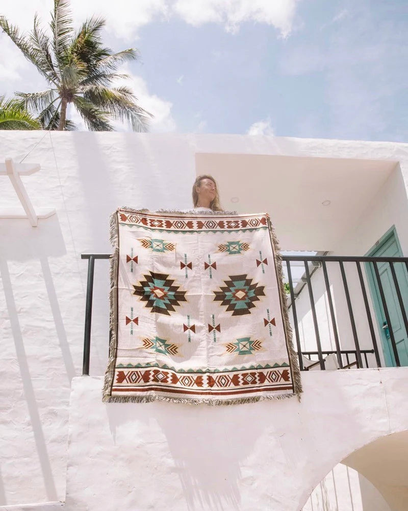 Boho geometric Aztec throw blanket with tassels, featuring earthy tones and a woven texture—perfect for cozy home decor