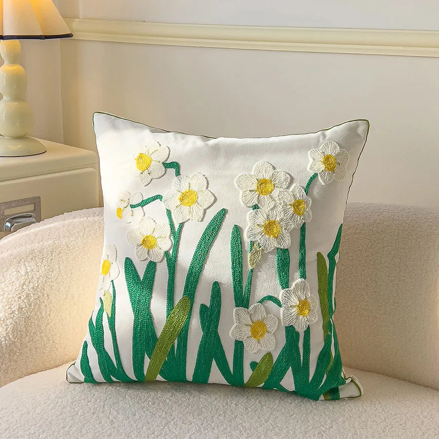 Decorative pillow with floral design on a couch