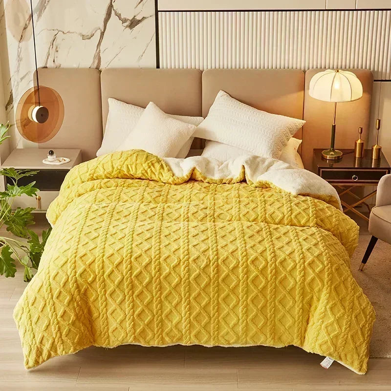 Yellow textured blanket on a bed in a bedroom setting with nightstands and decor. Soft plush duvet cover and blanket in solid color with striped jacquard design, dual-use artificial cashmere fleece bedding for cozy winter warmth