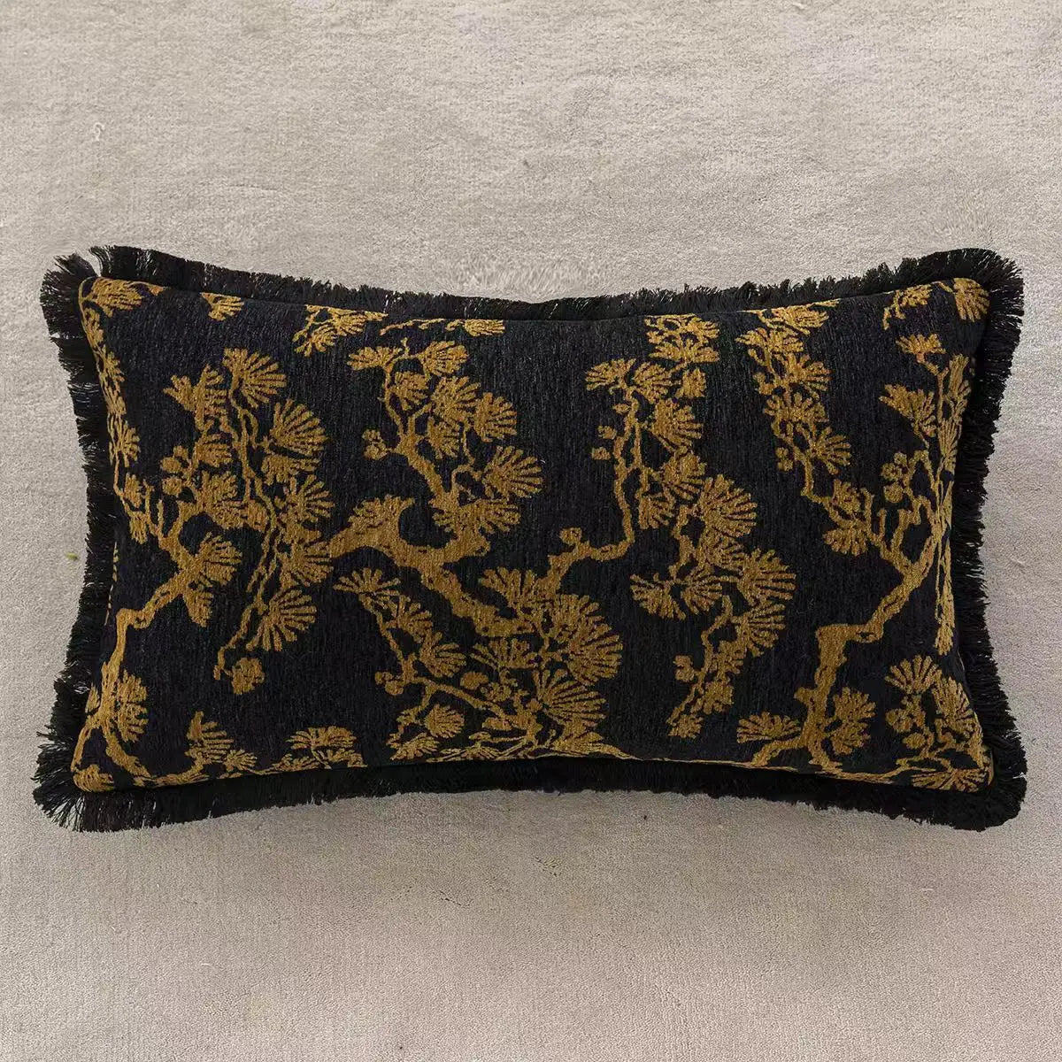 Decorative pillow with black and gold pattern on a neutral background. embroidery throw pillow cover in boho modern style