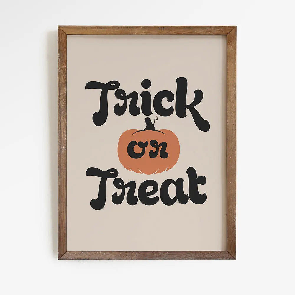 Framed Halloween-themed print with 'Trick or Treat' text and pumpkin illustration on a beige background. My Boho Home. Halloween cat and pumpkin canvas wall art, ghost cat and jack-o'-lantern print on cotton canvas, spooky cute autumn home decor for living room or kitchen.