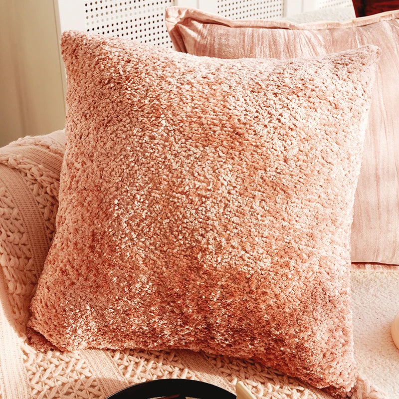 Fluffy pink pillow on a textured surface. Boho Home Decor.