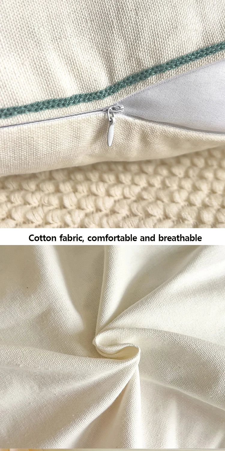 Close-up of a zipper on a pillow with cotton fabric shown below.