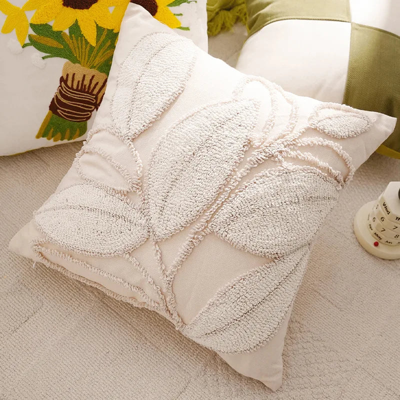 Decorative pillow with leaf pattern on a soft surface