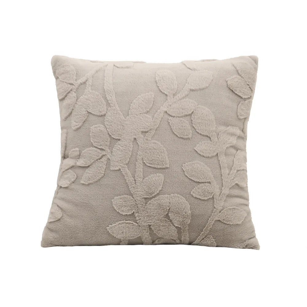 Decorative pillow with leaf pattern on a white background. Modern jacquard leaf throw pillow cover, woven floral decorative cushion for sofa, bed, or living room in neutral and soft tones.