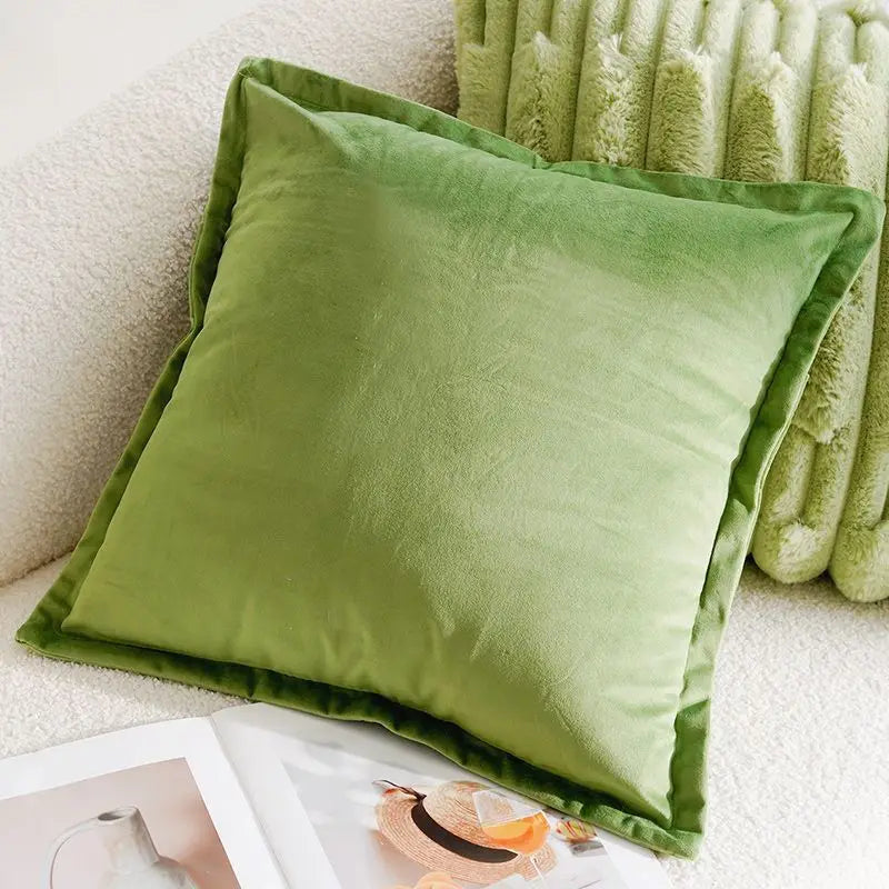 Green pillow and blanket on a white surface with a magazine underneath boho home decor, housewarming gift, embroidered pillow cover, flying bird cushion, animal pattern pillowcase, decorative throw pillow, Nordic cushion cover, luxury boho accent, sofa decor, nature-inspired pillow, canvas cushion case, textured home accessories
