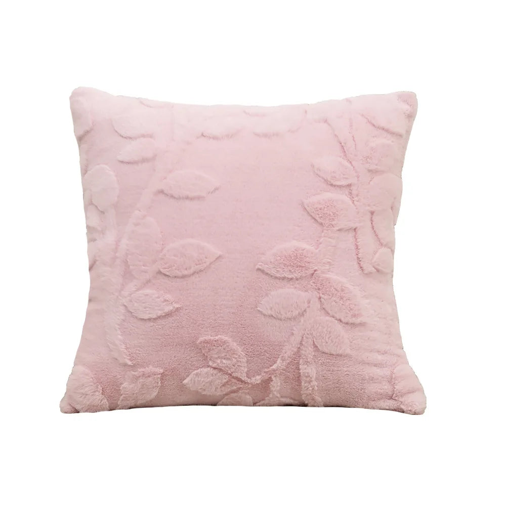 Pink textured pillow with floral patterns on a white background. Modern jacquard leaf throw pillow cover, woven floral decorative cushion for sofa, bed, or living room in neutral and soft tones.