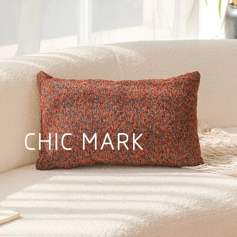 Textured pillow with 'CHIC MARK' on a beige sofa. Modern yarn-dyed throw pillow cover, luxury textured decorative cushion for sofa, bed, or window seating in soft neutral tones.