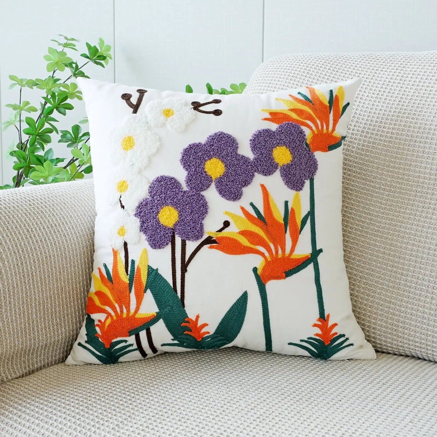 Decorative pillow with floral design on a couch. Floral embroidered throw pillow cover boho decor