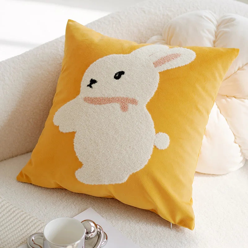 Yellow pillow with a bunny design on a white couch Nordic lily embroidered throw pillow cover in flannel fabric, floral square cushion case for sofa, bed, and boho home decor