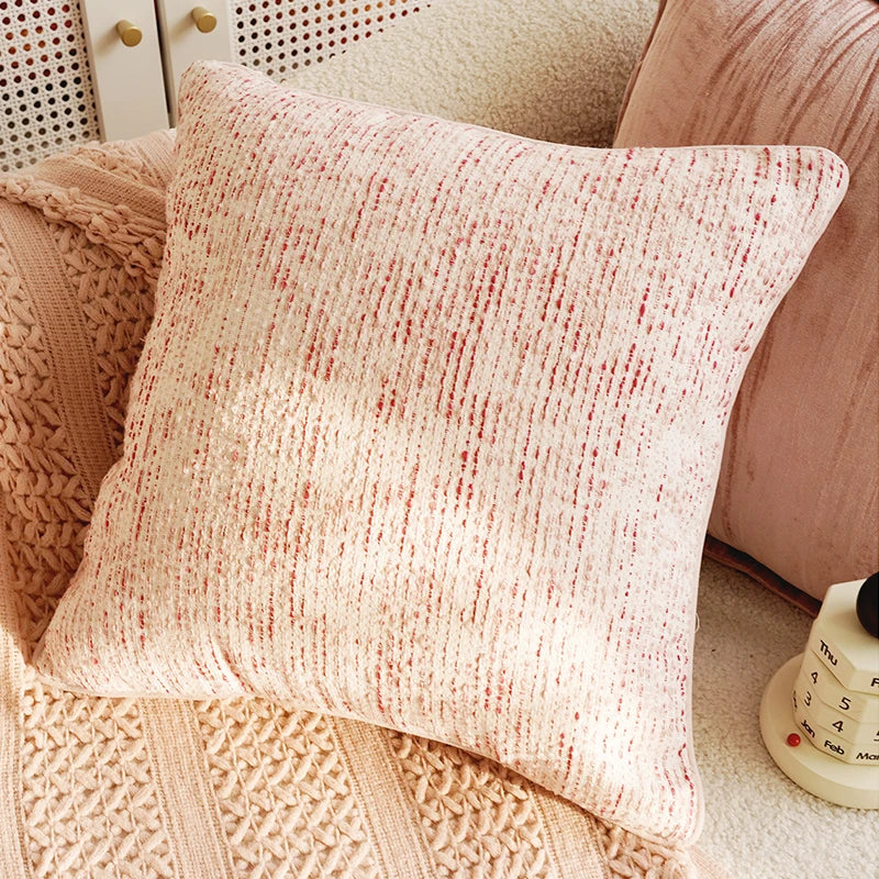 Textured pink pillow on a textured surface. Boho Home Decor.