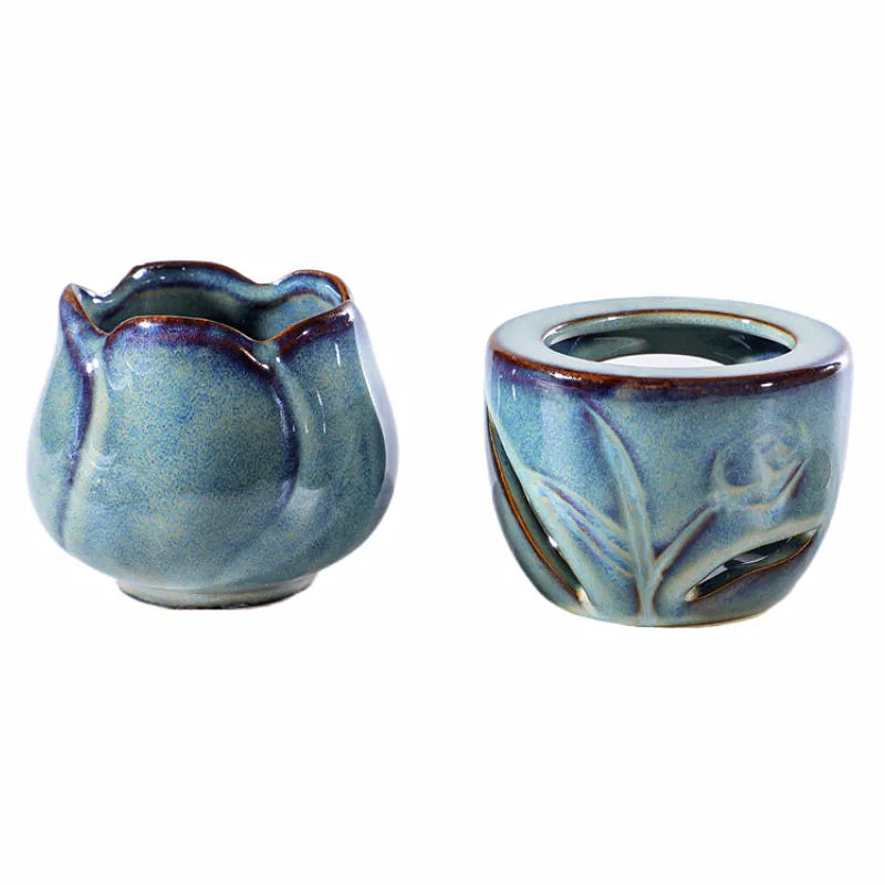 Two ceramic containers with floral designs on a white background. tulip ceramic essential oil incense burner, candle-powered aroma diffuser for home fragrance and calming boho home décor
