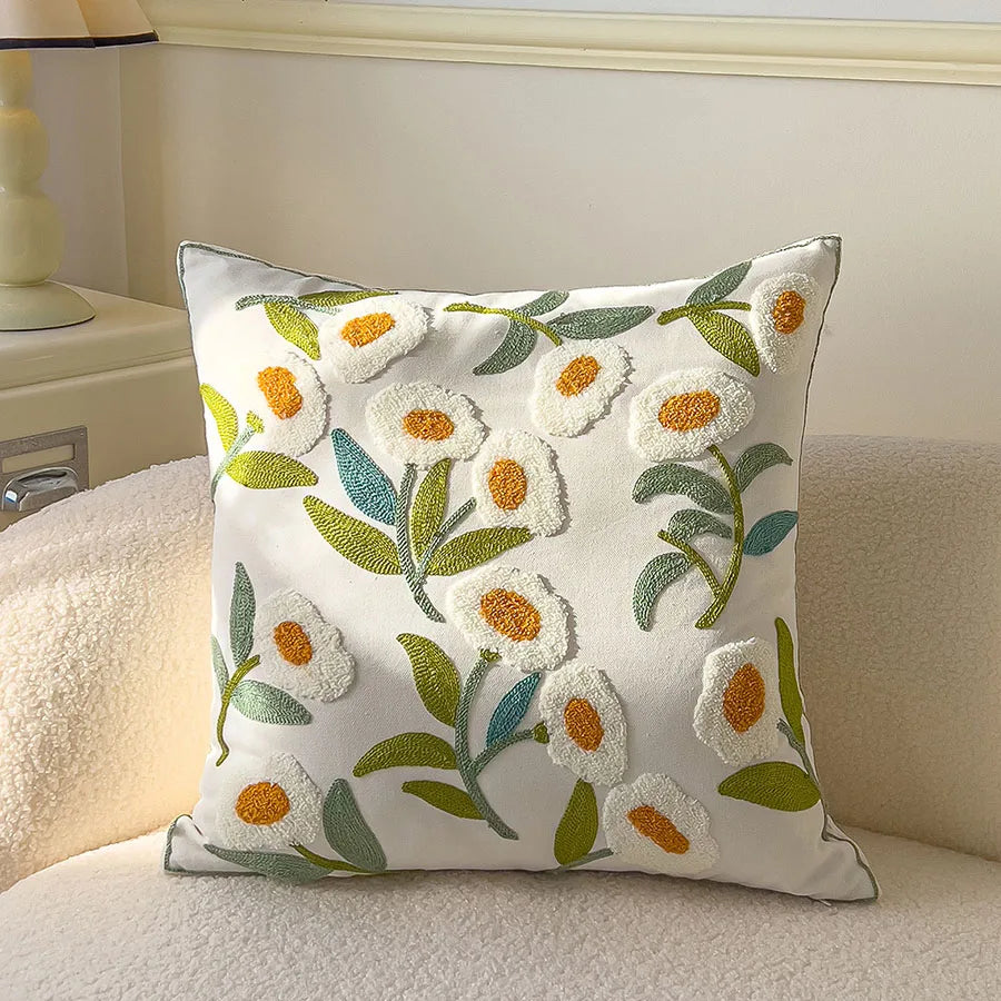 Decorative pillow with floral embroidery on a couch
