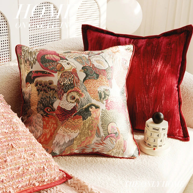 Decorative pillows on a couch with a red pillow and a decorative item. Boho Home Decor.