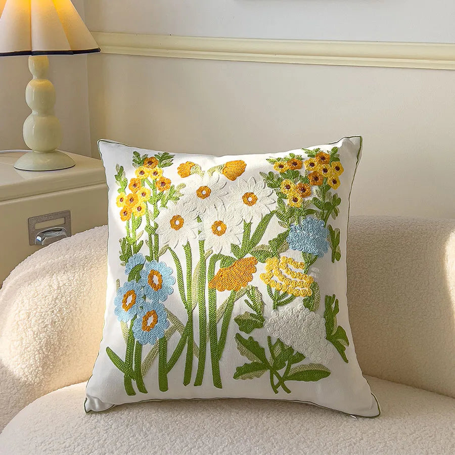 Decorative pillow with floral embroidery on a couch