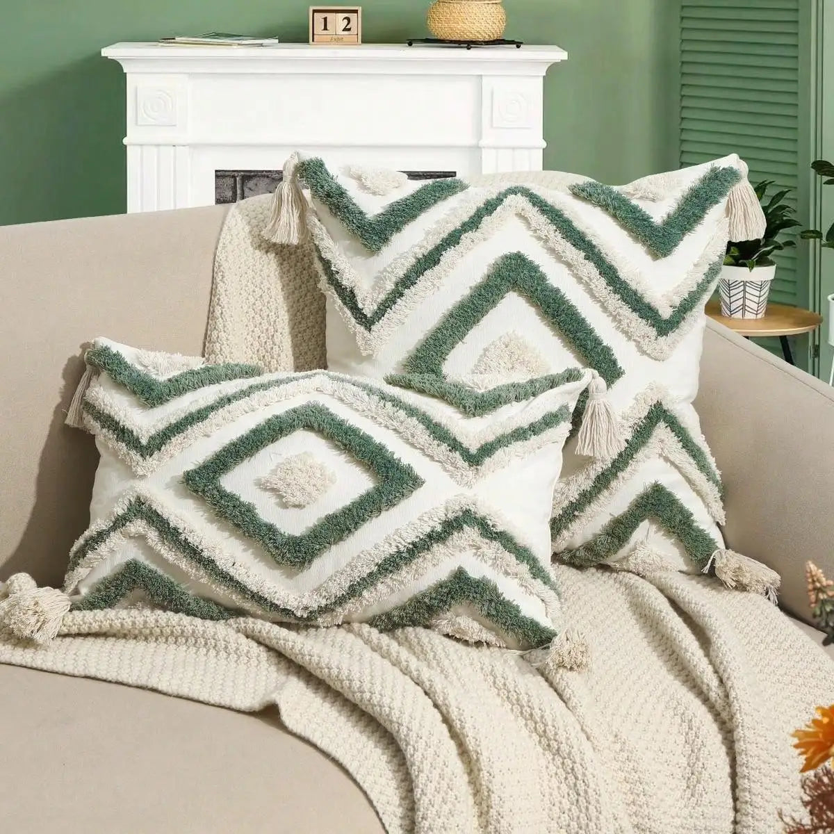 Decorative pillows with geometric patterns on a beige sofa against a green wall. Nordic Moroccan tufted throw pillow cover in geometric jacquard design, boho accent cushion for sofa, bed, or car, available in 12x20 inch lumbar and 18x18 inch square sizes – cozy textured boho home decor.