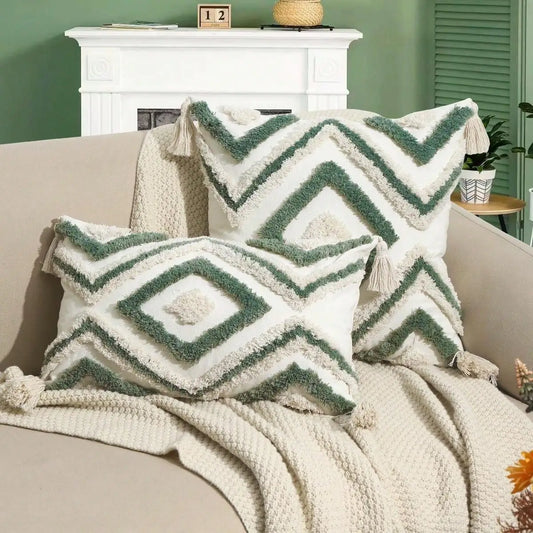 Decorative pillows with geometric patterns on a beige sofa against a green wall. Nordic Moroccan tufted throw pillow cover in geometric jacquard design, boho accent cushion for sofa, bed, or car, available in 12x20 inch lumbar and 18x18 inch square sizes – cozy textured boho home decor.