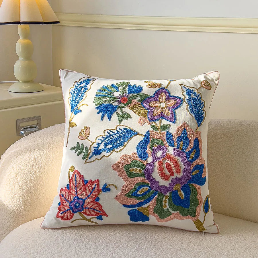 Decorative pillow with floral embroidery on a couch