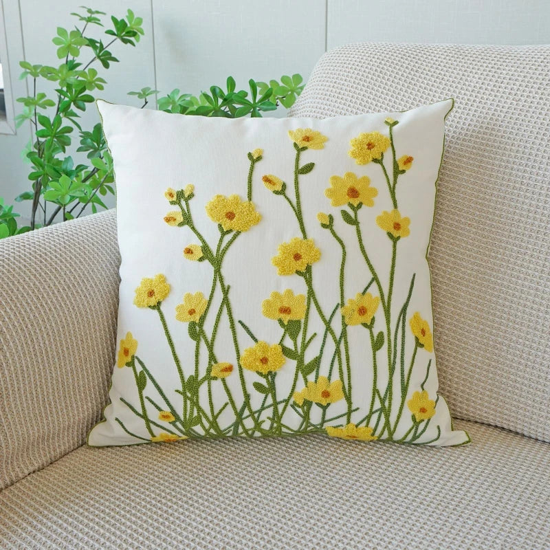 Decorative pillow with floral design on a beige couch. Floral embroidered throw pillow cover boho decor