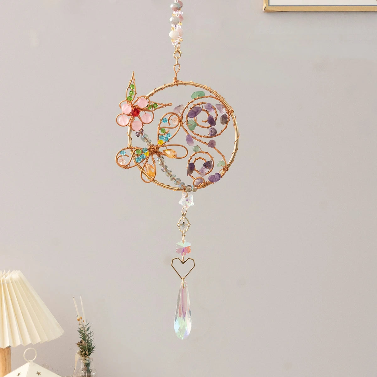Decorative hanging ornament with flowers and beads on a plain wall. boho home decor, crystal wind chime, sun catcher for windows, moon prism chime, agate stone hanging, garden art decor, patio hanging decoration, boho housewarming gift, spiritual gift, crystal suncatcher, balcony decor, meditation decor, handmade crystal chime