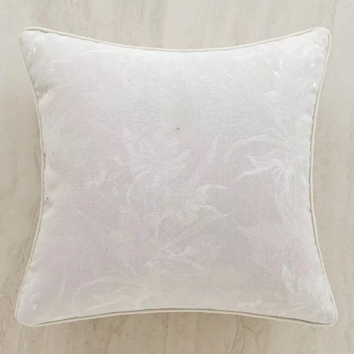 White textured pillow on a beige background. embroidery throw pillow cover in boho modern style