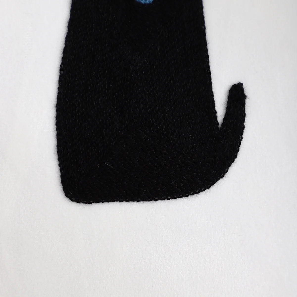 Black cat toy on a white background