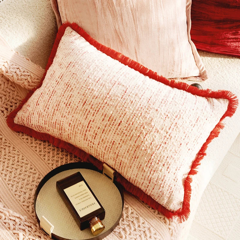 Decorative pillow with red trim on a textured surface. Boho Home Decor.