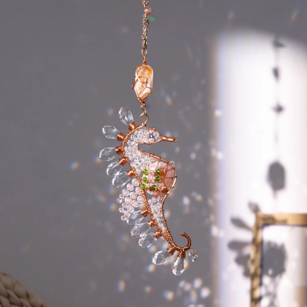 Delicate seahorse-shaped jewelry pendant with rose gold accents on a neutral background boho home decor, crystal wind chime, sun catcher for windows, moon prism chime, agate stone hanging, garden art decor, patio hanging decoration, boho housewarming gift, spiritual gift, crystal suncatcher, balcony decor, meditation decor, handmade crystal chime