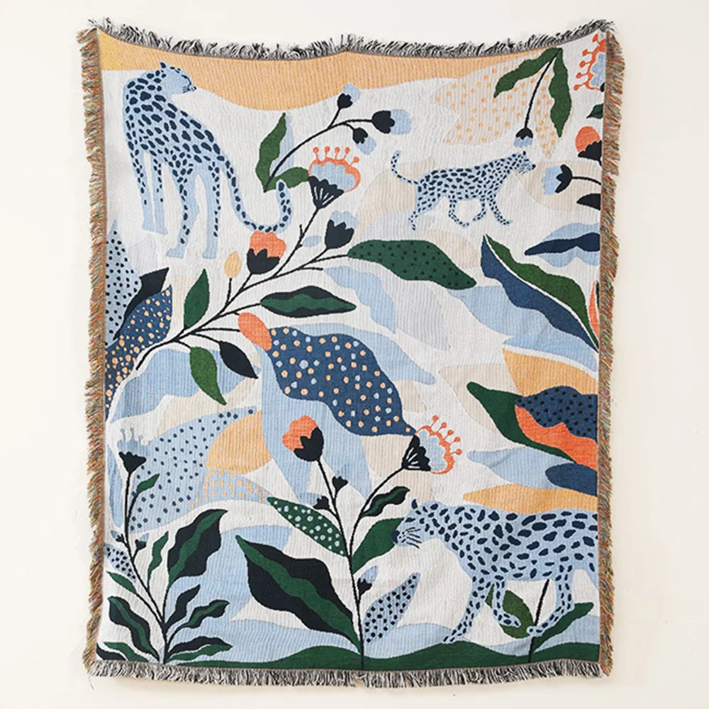 Decorative blanket with animal and floral pattern on a white background. Boho Home Decor.