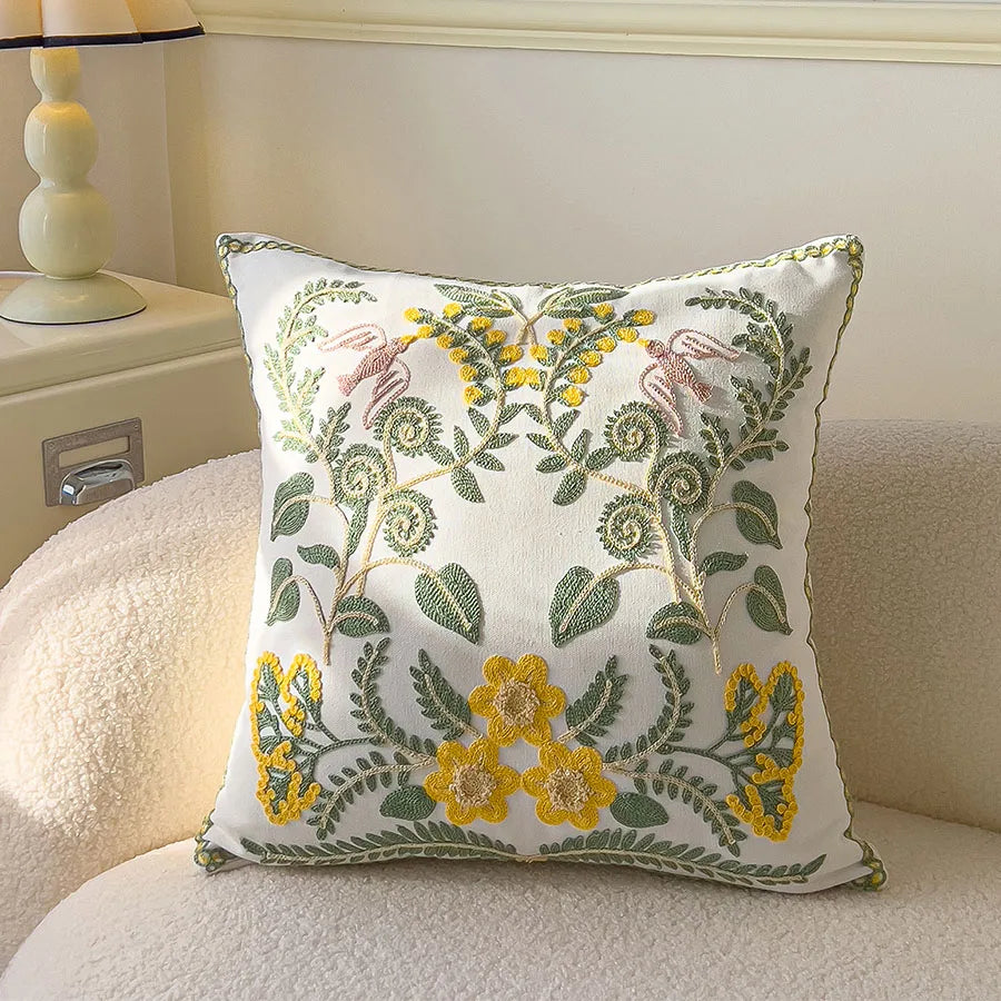 Decorative pillow with floral embroidery on a couch
