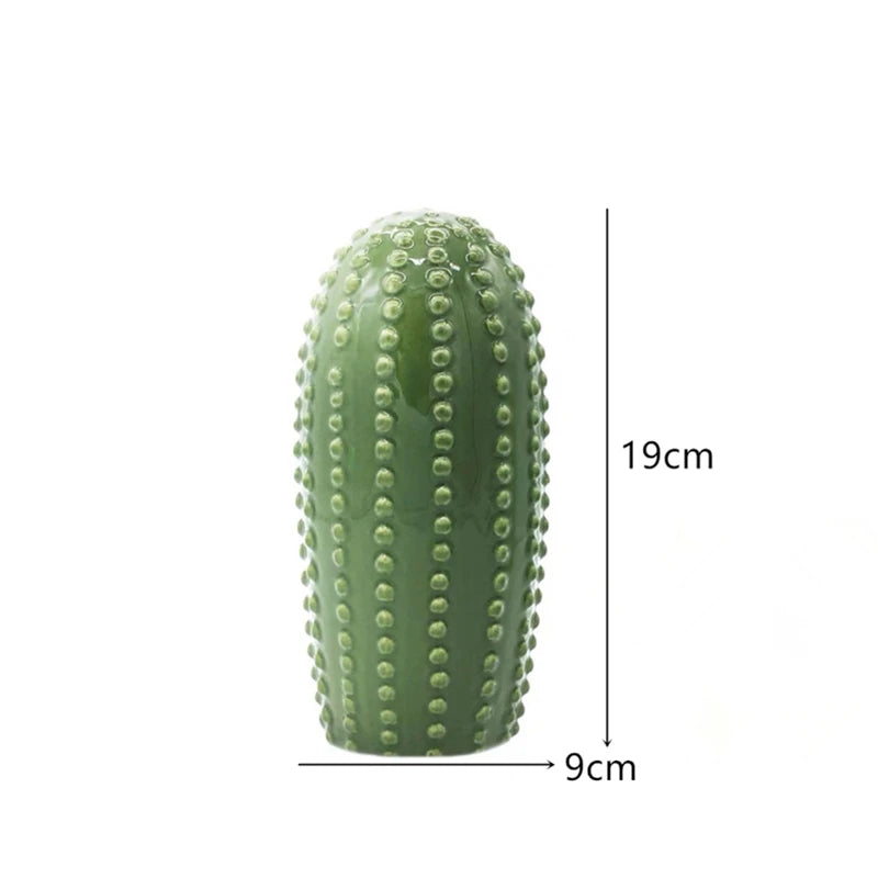 Green cactus-shaped object with measurements on a white background. Modern ceramic cactus figurine for home or office decoration. House warming gift.