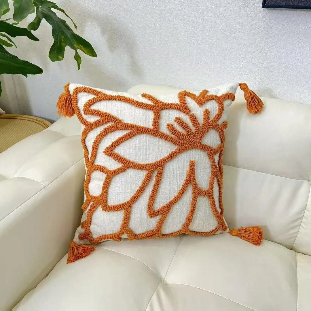 Decorative pillow with orange patterns and tassels on a white couch boho home decor, housewarming gift, chenille pillow cover, geometric cushion case, Nordic pillowcase, velvet throw pillow, sofa cushion, bedroom pillow cover, modern jacquard cushion, decorative car pillow, textured home decor, looped velvet pillow