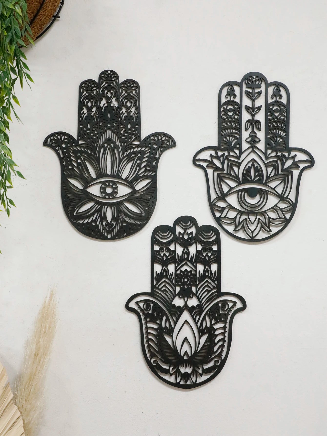 Boho Gothic wall decor featuring a black wooden hand with evil eye centerpiece, perfect for mystical home or dorm room decoration.