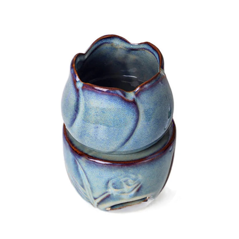 Blue ceramic flower-shaped container on a white background. tulip ceramic essential oil incense burner, candle-powered aroma diffuser for home fragrance and calming boho home décor
