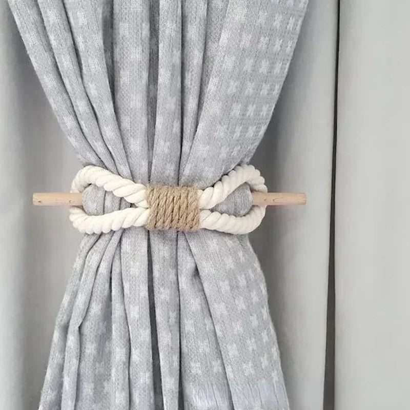 Gray curtain with a decorative rope and wooden holder on a neutral background boho home decor, curtain tie back, wooden curtain buckle, nordic home accessory, hemp rope curtain tie, rustic window decor, boho curtain accessory, modern farmhouse, minimalist curtain hold, housewarming gift idea