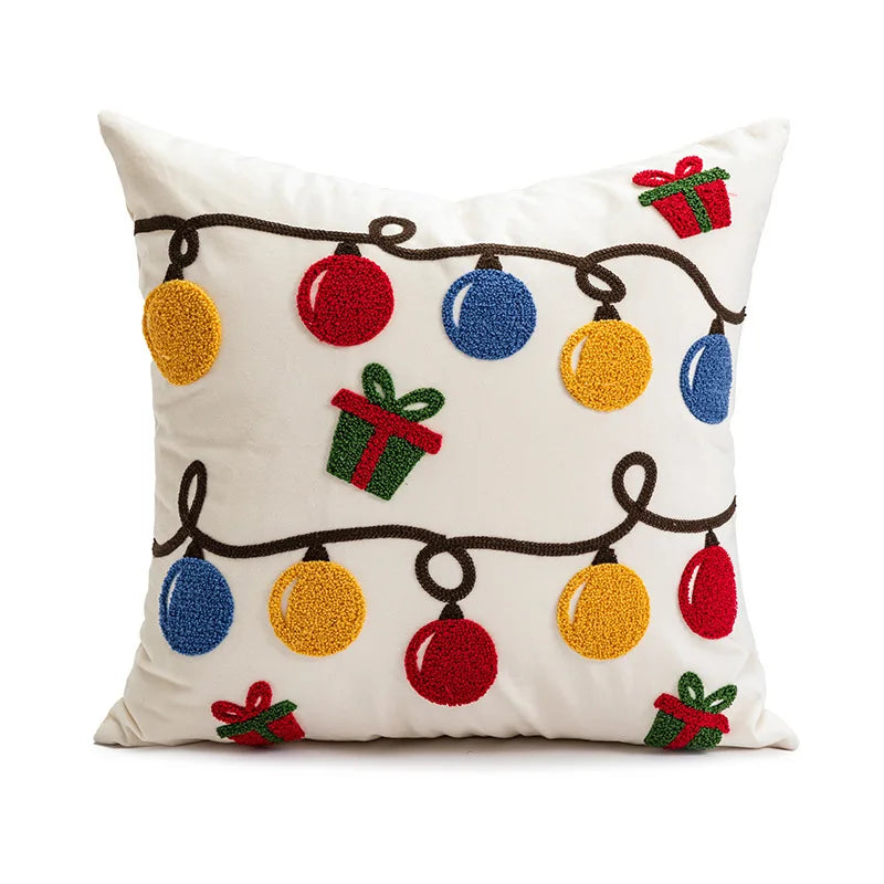 Decorative pillow with Christmas lights and presents on a white background
