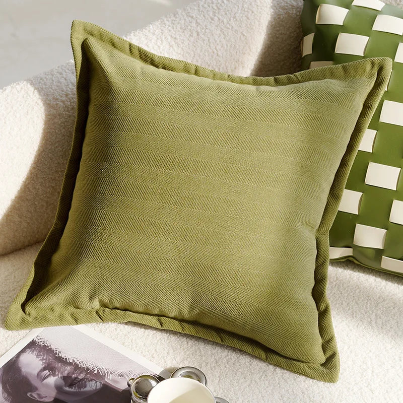 Green textured pillow on a white surface with another green pillow in the background boho home decor, housewarming gift, embroidered pillow cover, flying bird cushion, animal pattern pillowcase, decorative throw pillow, Nordic cushion cover, luxury boho accent, sofa decor, nature-inspired pillow, canvas cushion case, textured home accessories