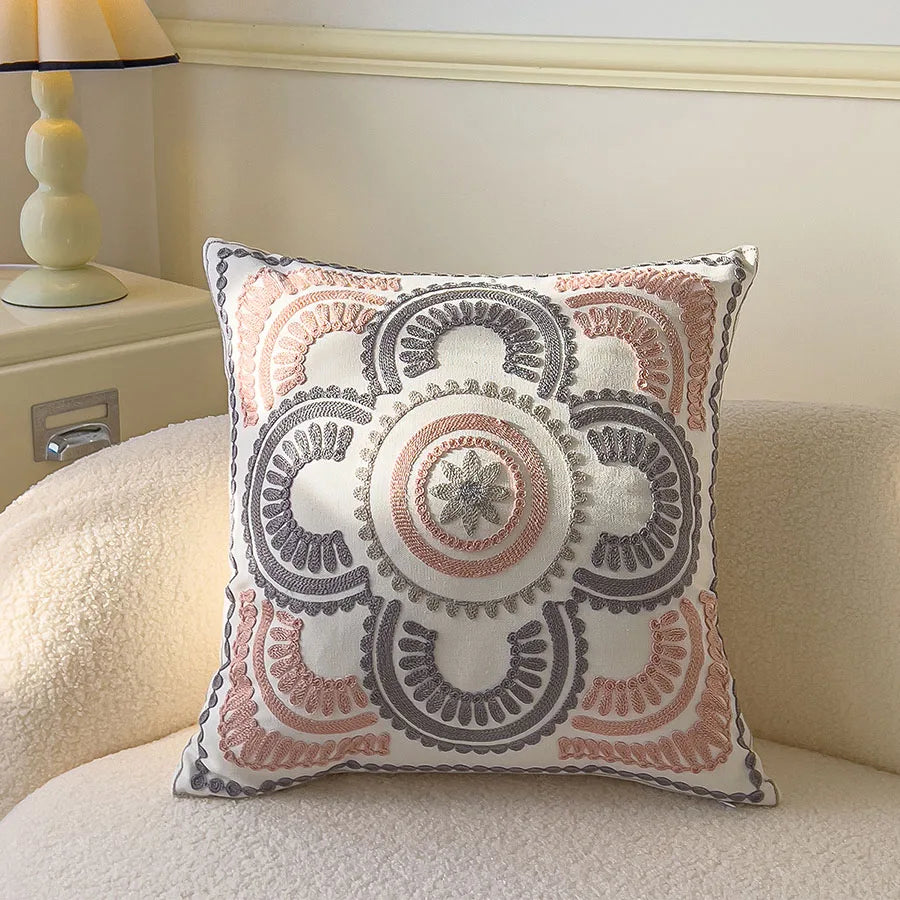 Decorative pillow with intricate patterns on a couch