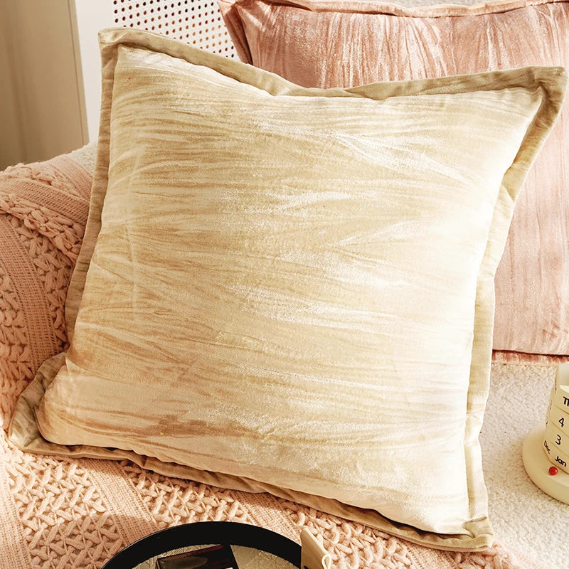 Beige textured pillow on a pink textured surface. Boho Home Decor.