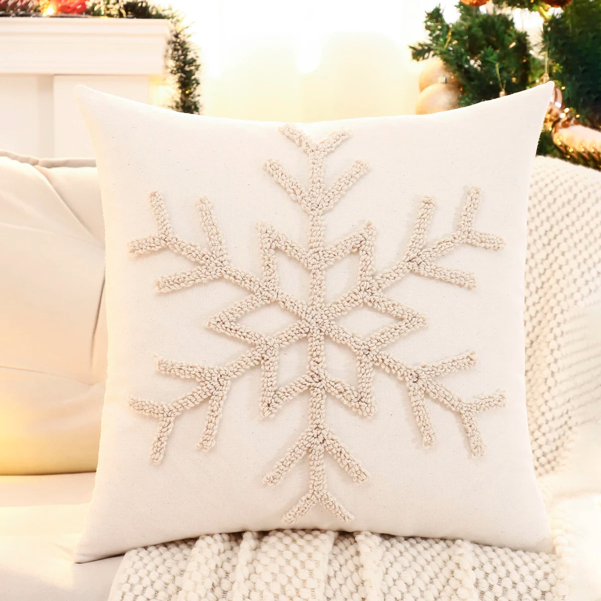 Decorative pillow with a snowflake pattern on a couch. Christmas embroidered pillow cover with tufted snowflake and reindeer design in 18x18 inches, festive canvas cushion case for sofa or bed