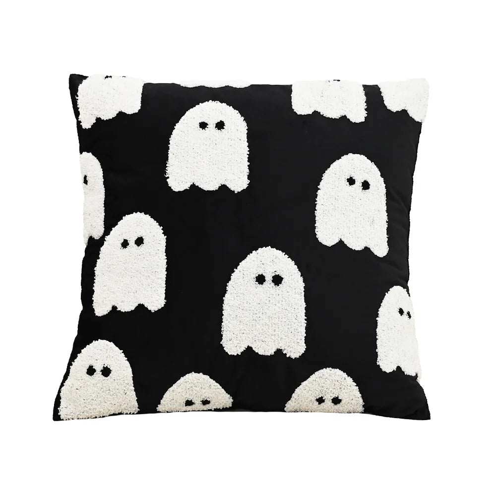 Pillow with white ghost pattern on a black background