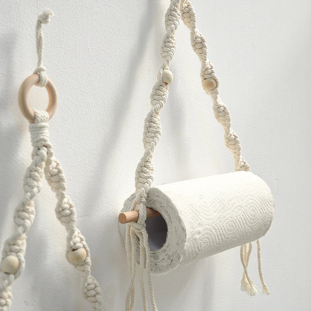 Macrame plant hanger with wooden rings on a white background boho home decor, toilet paper holder, bohemian bathroom accessory, tissue holder, wall-mounted towel rack, cotton rope toilet paper rack, wooden bead towel holder, rustic home decor, boho wall decor, bathroom organization, housewarming gift