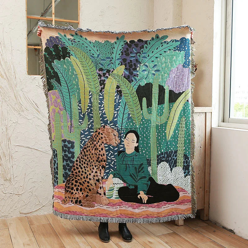 Decorative blanket with a leopard and person design draped over a chair. Boho Home Decor.