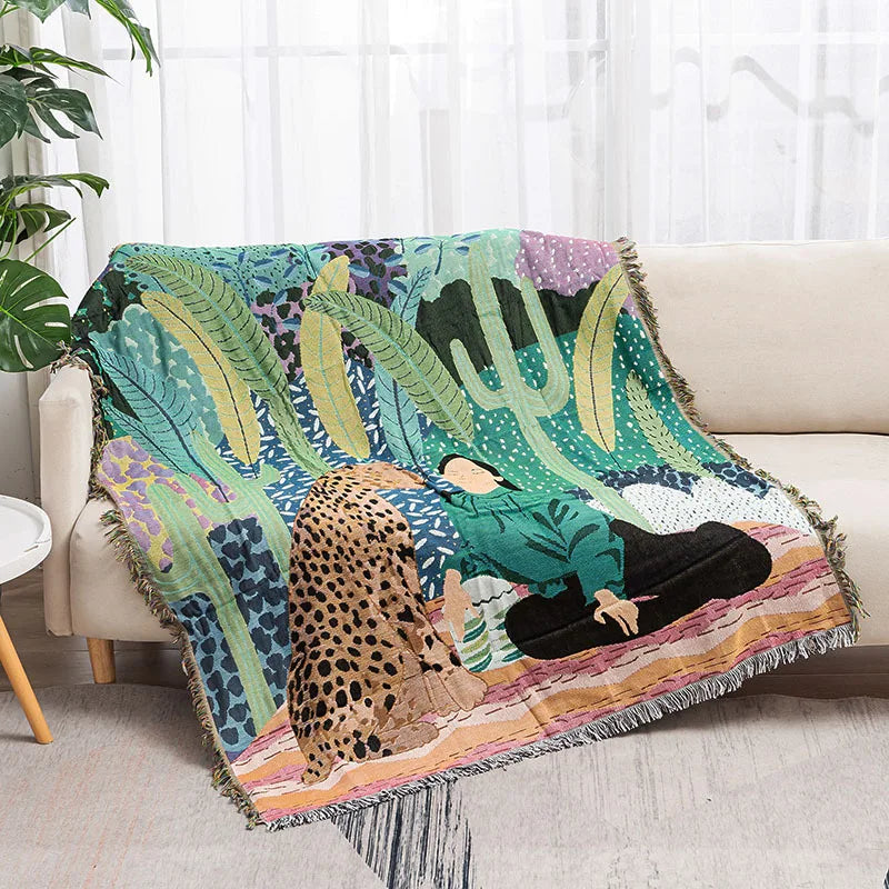 Colorful blanket with a design of a person and a leopard on a couch. Rainforest cheetah geometric throw blanket, abstract woven tapestry for sofa or wall decor, cotton boho blanket for modern home styling.