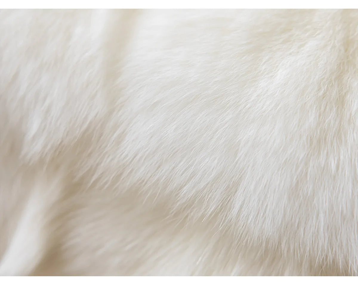 Close-up of white fur texture, embroidery throw pillow cover in boho modern style