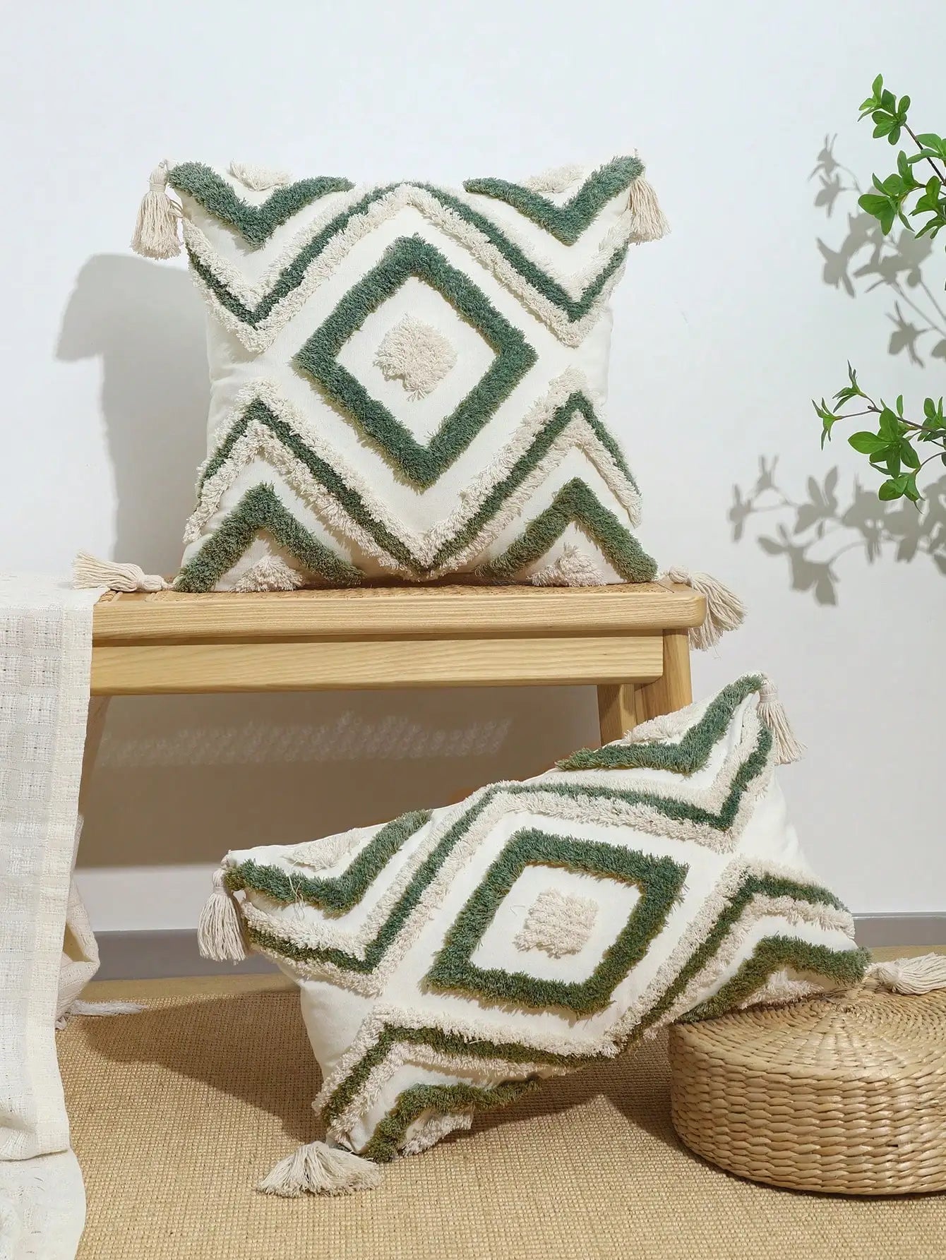 Green and white patterned pillows on a wooden chair with a plant in the background Nordic Moroccan tufted throw pillow cover in geometric jacquard design, boho accent cushion for sofa, bed, or car, available in 12x20 inch lumbar and 18x18 inch square sizes – cozy textured boho home decor.