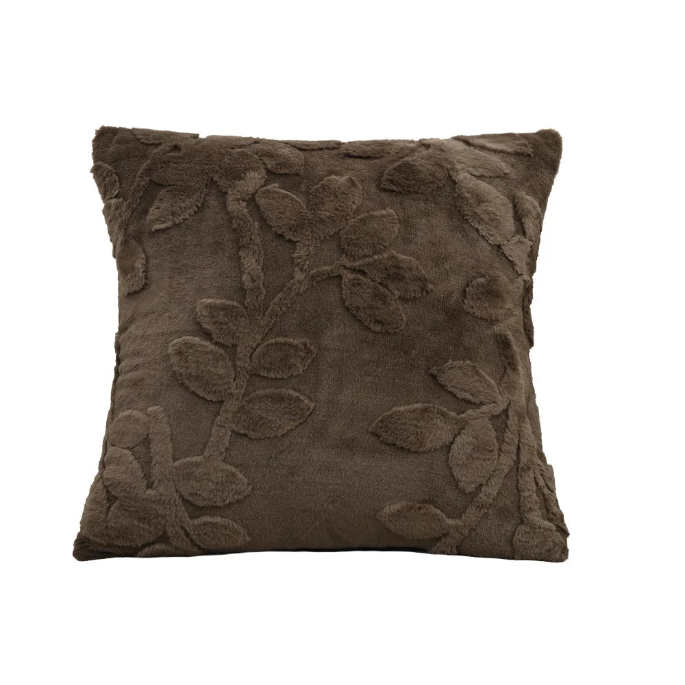 Brown decorative pillow with leaf patterns on a white background. Modern jacquard leaf throw pillow cover, woven floral decorative cushion for sofa, bed, or living room in neutral and soft tones.