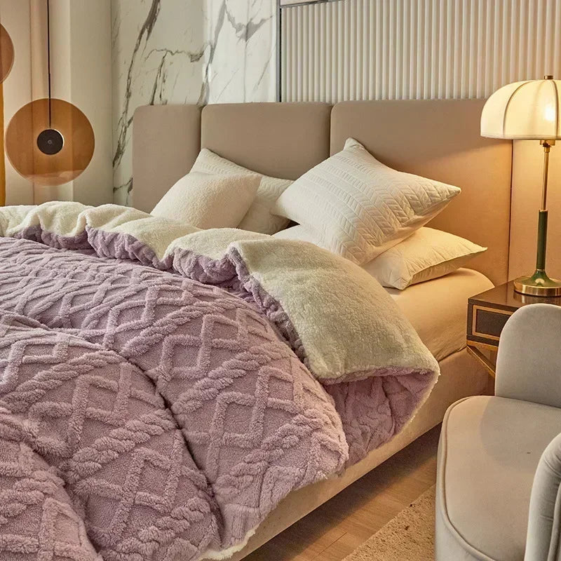 Neatly made bed with pink textured blanket and white pillows in a bedroom setting. Soft plush duvet cover and blanket in solid color with striped jacquard design, dual-use artificial cashmere fleece bedding for cozy winter warmth