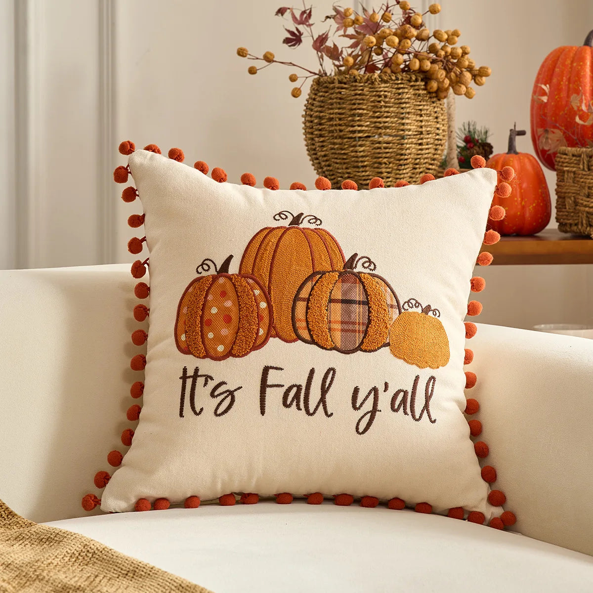 Decorative pillow with pumpkins and 'It's Fall y'all' text on a couch. Halloween and Thanksgiving decorative pillow cover For Fall